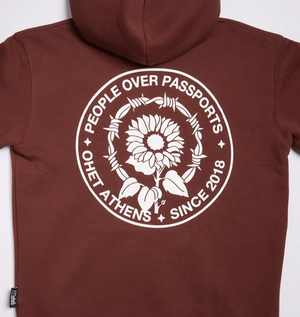 Brown Hoodie "People over Passports" Graphic on back.